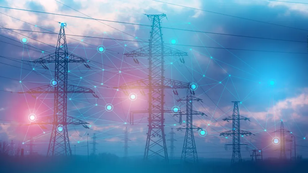 Torres de alta tensión conectadas por una red de puntos luminosos que simboliza la red eléctrica interconectada
